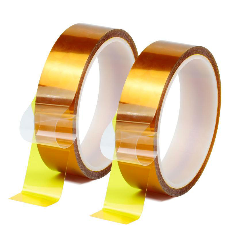 Double-sided polyimide Kapton tape rolls with clear release liners for electronics assembly.