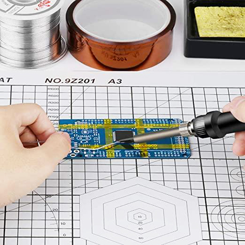 Polyimide Kapton tape protecting electronic components on a circuit board during PCB soldering.