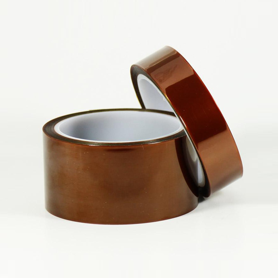 Two rolls of thick amber polyimide Kapton tape stacked for heavy-duty electrical insulation.