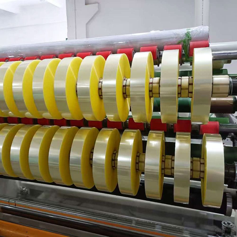 Precision slitted clear BOPP packing tape rolls on automatic slitter