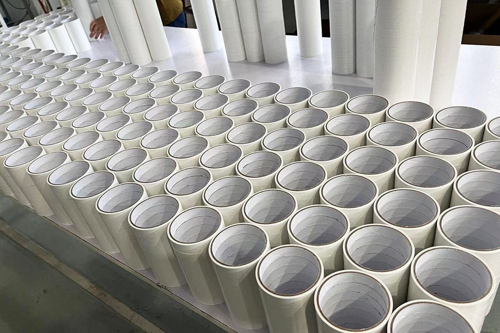 Neatly aligned finished double sided tape rolls ready for laboratory quality sampling and batch inspection