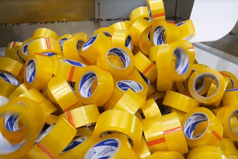 Bulk yellow clear BOPP packing tape rolls in factory production process by KRYTAP