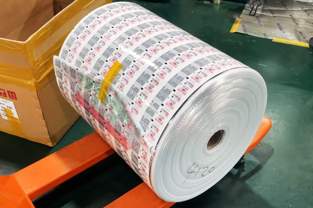 Krytape custom printed BOPP tape jumbo roll being manufactured in factory for wholesale supplier.